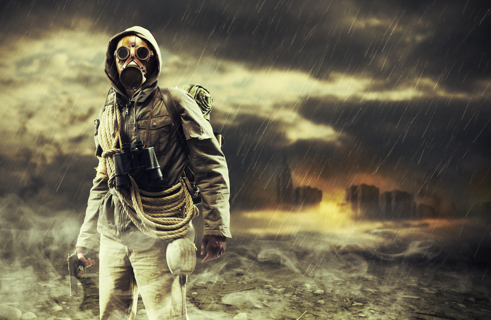 A lonely hero wearing gas mask, city destroyed on the background
